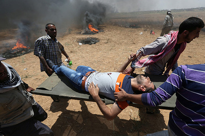 Израильтяне расстреляли десятки палестинцев в день открытия посольства США